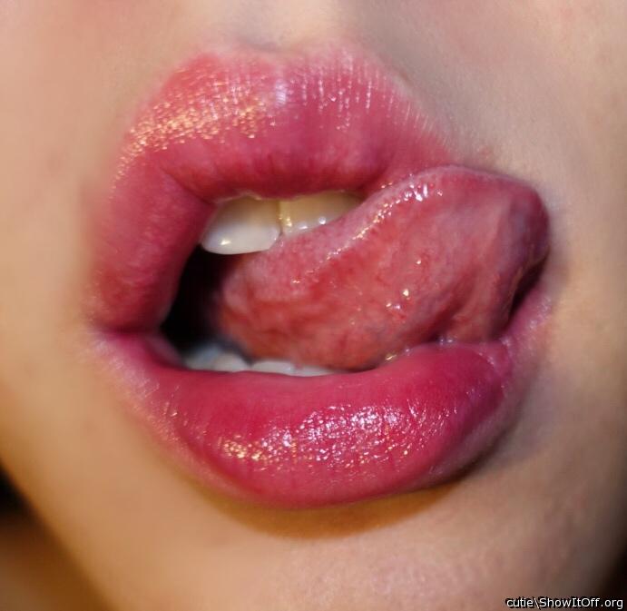 Licking lips.