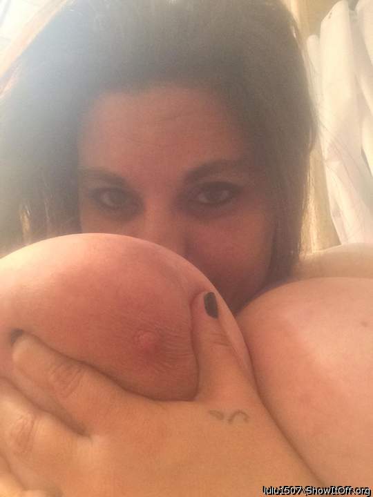 Beautiful woman hiding behind a beautiful tit