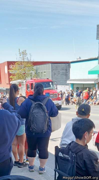 my brother in-law taking pics of me at the parade like my leggings?