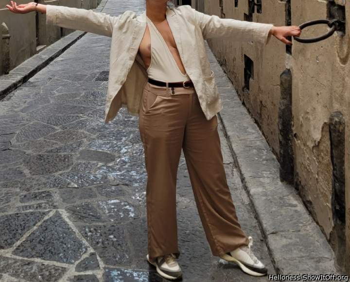 Nipple slip on the street with people passing by