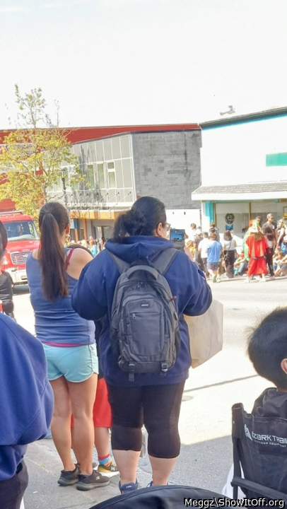 my brother in-law taking pics of me at the parade like my leggings?