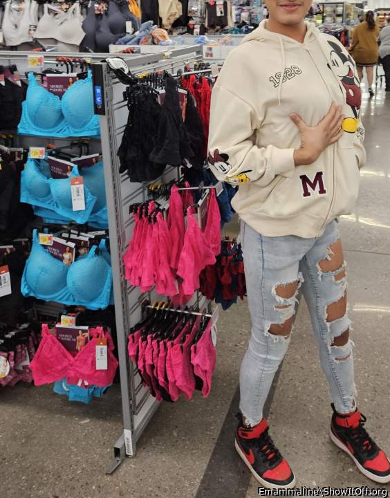 He trying a bra at walmart